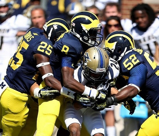 Dymonte Thomas (25), Channing Stribling (8), and Royce Jenkins-Stone (52)
