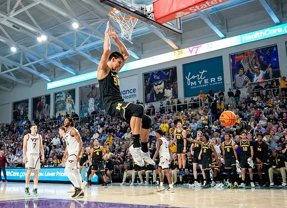 Vladislav Goldin (50) and Michigan Team