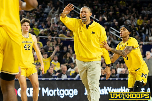 Will Tschetter (42), Juwan Howard, and Dug McDaniel (0)