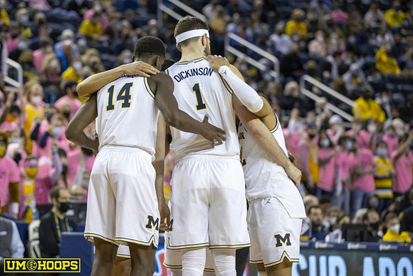 Moussa Diabate (14), Hunter Dickinson (1), and DeVante' Jones (12)