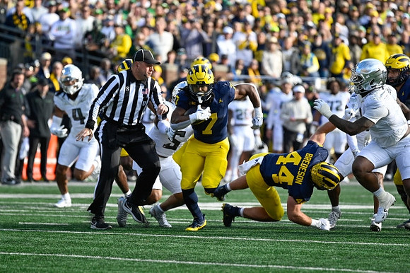 Donovan Edwards (7) and Max Bredeson (44)