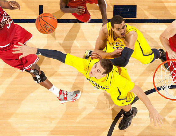 Mitch McGary (4) and Jordan Morgan (52)