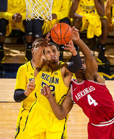 Mitch McGary (4) and Jordan Morgan (52)