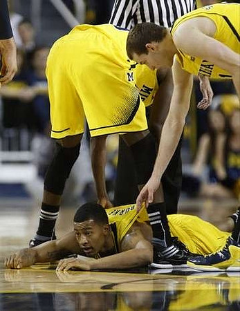Trey Burke (3) and Mitch McGary (4)