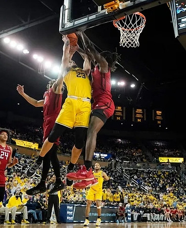 Brandon Johns Jr. (23) and DeVante' Jones (12)