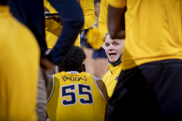 Phil Martelli, Eli Brooks (55), and Michigan Team