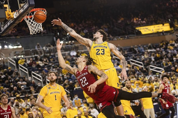 Hunter Dickinson (1), Brandon Johns Jr. (23), and DeVante' Jones (12)