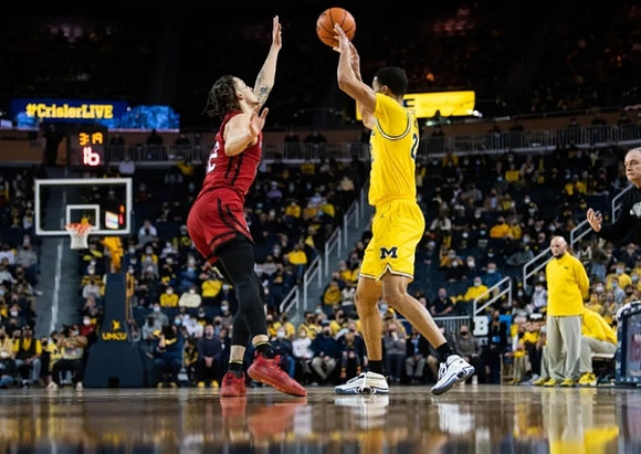 Caleb Houstan (22), Phil Martelli, and Rutgers Head Coach Steve Pikiell