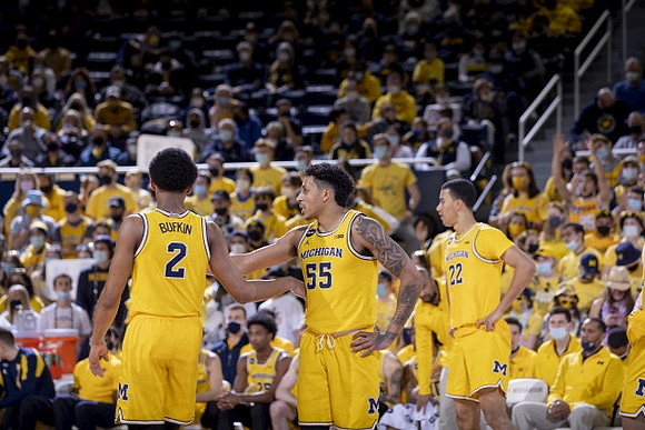 Kobe Bufkin (2), Eli Brooks (55), and Caleb Houstan (22)