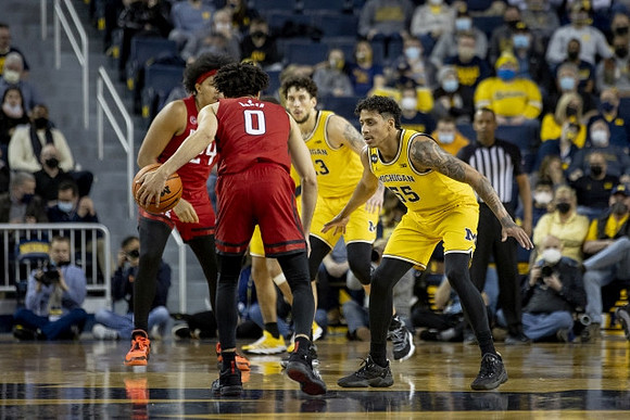 Brandon Johns Jr. (23) and Eli Brooks (55)