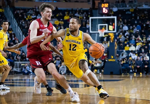 DeVante' Jones (12) and Caleb Houstan (22)