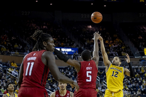 Kobe Bufkin (2) and DeVante' Jones (12)