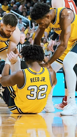 Hunter Dickinson (1), Tarris Reed Jr. (32), and Jace Howard (25)