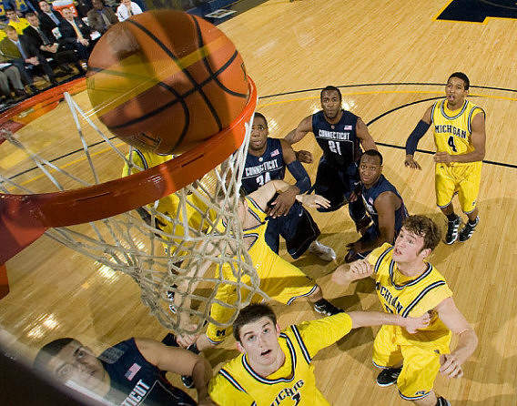 Stu Douglass (1), Zack Novak (0), and Darius Morris (4)