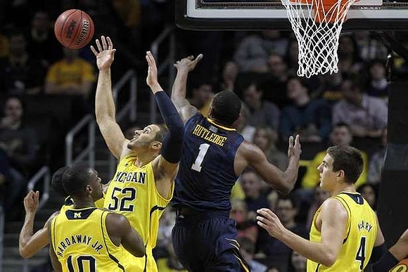 Tim Hardaway Jr. (10), Jordan Morgan (52), and Mitch McGary (4)