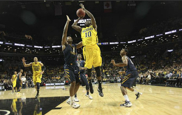 Tim Hardaway Jr. (10), Jordan Morgan (52), and Trey Burke (3)
