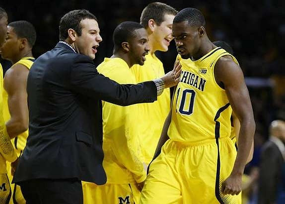 Josh Bartelstein (20), Corey Person (32), Mitch McGary (4), and Tim Hardaway Jr. (10)