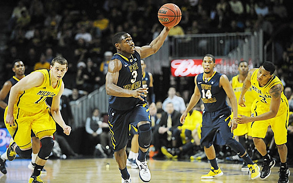 Nik Stauskas (11), Glenn Robinson III (1), and Trey Burke (3)
