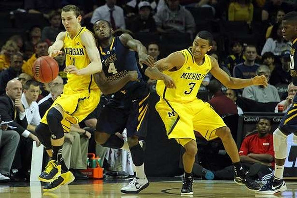 Nik Stauskas (11) and Trey Burke (3)