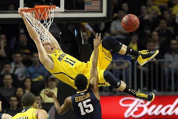 Nik Stauskas (11) and Jordan Morgan (52)