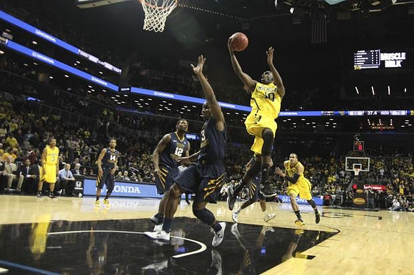 Trey Burke (3), Tim Hardaway Jr. (10), and Jordan Morgan (52)