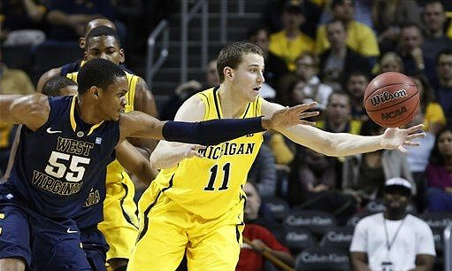 Nik Stauskas (11) and Glenn Robinson III (1)