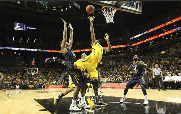 Glenn Robinson III (1) and Jordan Morgan (52)