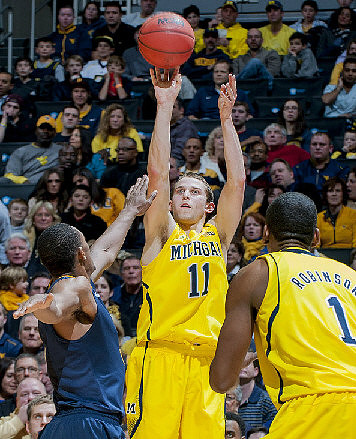 Nik Stauskas (11) and Glenn Robinson III (1)