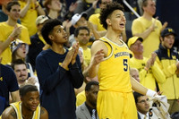 Xavier Simpson (3), Ibi Watson (23), and D.J. Wilson (5)