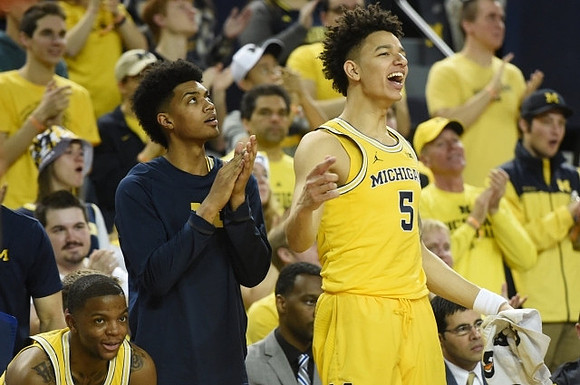 Xavier Simpson (3), Ibi Watson (23), and D.J. Wilson (5)