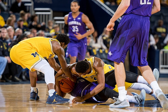 Derrick Walton Jr. (10) and Zak Irvin (21)