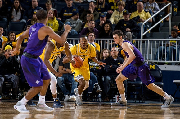 Muhammad-Ali Abdur-Rahkman (12) and Derrick Walton Jr. (10)