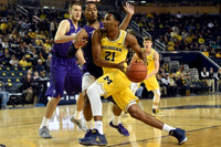Zak Irvin (21) and Moritz Wagner (13)