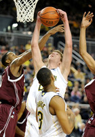 Evan Smotrycz (23) and Trey Burke (3)