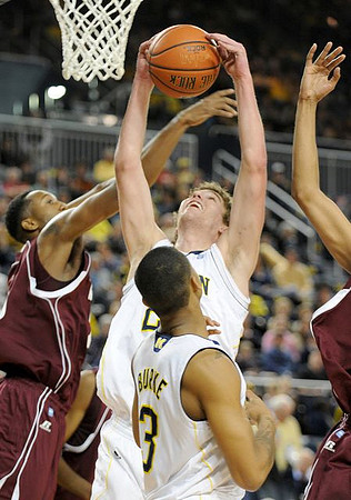 Evan Smotrycz (23) and Trey Burke (3)