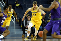 Derrick Walton Jr. (10) and Moritz Wagner (13)