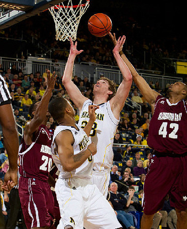 Trey Burke (3) and Evan Smotrycz (23)