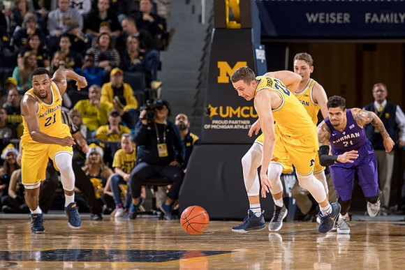 Zak Irvin (21), Duncan Robinson (22), and Mark Donnal (34)