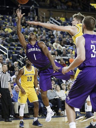 Moritz Wagner (13) and Derrick Walton Jr. (10)
