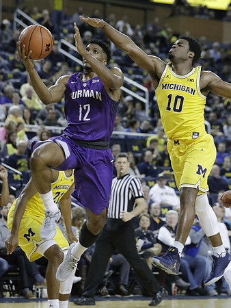 Derrick Walton Jr. (10) and Zak Irvin (21)