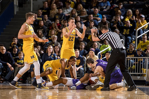 Moritz Wagner (13), Zak Irvin (21), and Duncan Robinson (22)