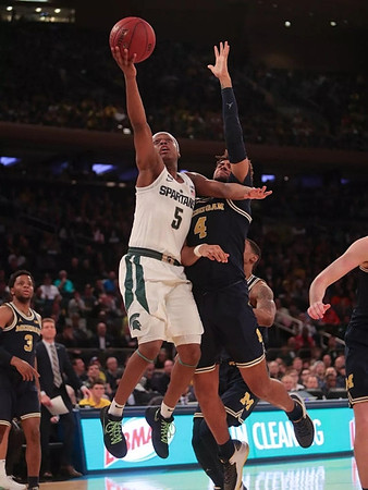 Zavier Simpson (3) and Isaiah Livers (4)