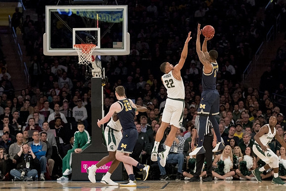 Jon Teske (15) and Charles Matthews (1)