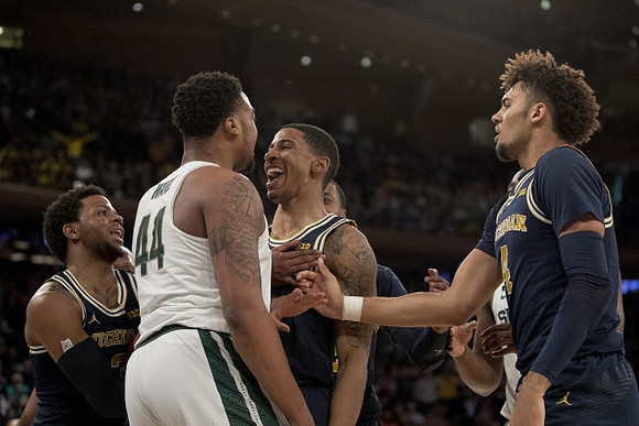 Zavier Simpson (3), Charles Matthews (1), and Isaiah Livers (4)