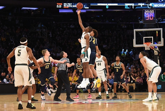Moritz Wagner (13), Muhammad-Ali Abdur-Rahkman (12), Isaiah Livers (4), and Zavier Simpson (3)
