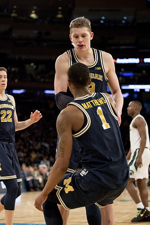 Duncan Robinson (22), Charles Matthews (1), and Moritz Wagner (13)