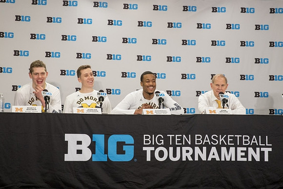Moritz Wagner (13), Duncan Robinson (22), Muhammad-Ali Abdur-Rahkman (12), and John Beilein