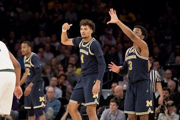 Muhammad-Ali Abdur-Rahkman (12), Isaiah Livers (4), and Zavier Simpson (3)