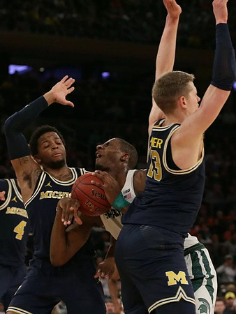 Isaiah Livers (4), Zavier Simpson (3), and Moritz Wagner (13)