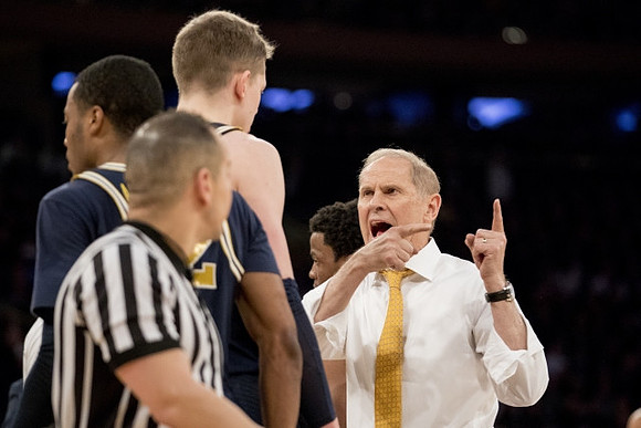 Muhammad-Ali Abdur-Rahkman (12), Moritz Wagner (13), Zavier Simpson (3), and John Beilein